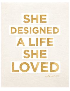 the words she designed a life she loved are shown in gold foil on white paper