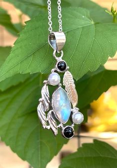 "Handmade, vintage, one-of-a-kind, fit for a goddess or a god, artisan piece, natural rainbow moonstone +natural pearls +natural black onyx, pendant necklace set in 925 sterling silver. 18 inches long 925 sterling silver chain. Pendant dimensions: 1.50\"(1.90\" including bail) X 0.90\"" Unique Black Jewelry With Moon Phase, Unique Black Moon Phase Jewelry, Handmade Black Moonstone Jewelry, Black Moonstone Necklace For Gift, Bohemian Black Moonstone Jewelry, Elegant Black Moonstone Jewelry, Black Moonstone Spiritual Jewelry, Spiritual Black Moonstone Jewelry, Chrysoprase Ring