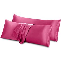 two pillow cases with pink satin sheets on them