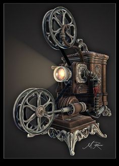 an old movie projector sitting on top of a wooden table next to a lamp