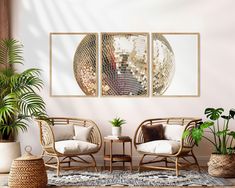 a living room with two chairs and a large mirror ball on the wall above them