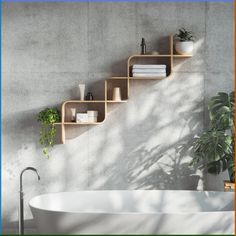 a bath tub sitting under a wooden shelf next to a wall mounted planter with books on it