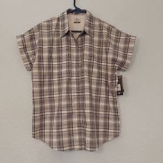 Ridgecut Toughwear Short Sleeve Camp Shirt New With Tags - Great Shirt To Wear To To Give. Grayish Blue And Cream Color Plaid Button Up Shirt Two Front Pockets Flex - Some Stretch To The Fabric New With Tags. Light Storage Wear To Tags. 66% Polyester 30% Cotton 4% Spandex Measures Approximately 23 Inches Armpit To Armpit Across Front. Approximately 26 Inches From Top Of Shoulder Seam To Bottom Hem. Bundle 3 Or More Items To Save. Please Keep Bundle Weight Under 5 Lbs. This Shirt Will Weigh About Short Sleeve Flannel Outfits, Adidas Shorts Women, Short Sleeve Flannel, Black Button Up Shirt, Wedding Moodboard, Flannel Outfits, Oversized Flannel, Leopard Print Shirt, Grayish Blue