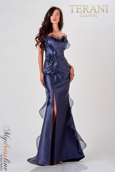 Looking for a show-stopping evening dress? Look no further than the Terani Couture 2111E4743. This sultry navy gown features a sweetheart neckline and tule frills that create a beautiful flower on one side. Extra glamour is added all over the dress, making it perfect for any formal occasion. Sleek Gown, Navy Evening Dress, Navy Evening Dresses, Couture Evening Dress, Mermaid Evening Gown, Prom Dress Stores, Terani Couture, Floor Length Gown, Mermaid Skirt