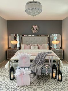 a bed room with a neatly made bed and lots of gifts