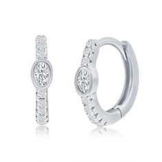 These luxurious sterling silver hoop earrings add an element of sophistication to any ensemble with their oval Cubic Zirconia  huggie design. An elegant and tasteful choice, this exclusive pair of earrings is sure to add a touch of glamour to any look.0.8grms*ENLARGED TO SHOW DETAILClosure:SnapColor:Silver.Main Stone:Cubic ZirconiaMain Stone Color:ClearMain Stone Shape:RoundMain Stone Creation:Lab-CreatedMain Stone Treatment:Not EnhancedSecond Stone:No StoneCustomized:NoHandmade:YesSigned:NoVint Sterling Silver Hoop Earrings, Huggie Hoop Earrings, Sterling Silver Hoops, Fine Jewellery Earrings, Silver Hoops, Silver Hoop Earrings, Fashion Earrings, Stone Color, Cubic Zirconia