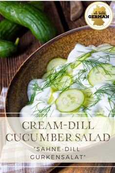 cream - dill cucumber salad in a bowl with sour cream on top