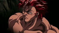 an anime character with red hair sitting in the dark