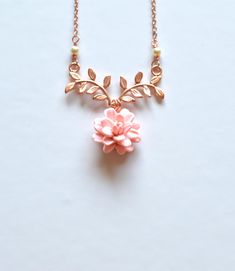 "2018 COLLECTION, a nature inspired necklace featuring blush Dahlia flower dangled on metal branch. If you prefer different color, please drop a note. Detail : - Hand sculpted Dahlia made of Polymer Clay . Size approx: 16-17mm. - Rose Gold plated over brass branch. - Cream Swarovski Pearls - Gold Plated over brass chain as pictured, silver plated, rose gold available. - Entire length 16\" + 2 extenders. - Handmade in The USA - Made to order in 3-4 business days. If you need earlier shipping date Rose Gold Flower Pendant Necklace, Nature-inspired, Rose Gold Flower Pendant Necklace Nature-inspired, Rose Gold Nature-inspired Flower Pendant Necklace, Rose Gold Flower Pendant Necklace, Nature-inspired Rose Gold Necklace, Delicate Pink Pendant Flower Necklace, Delicate Pink Flower Pendant Necklace, Nature-inspired Rose Gold Pendant Necklace, Elegant Pink Birth Flower Necklaces