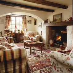 a living room filled with furniture and a fire place