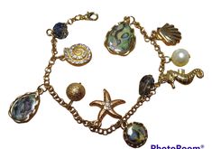 Beautiful ocean themed bracelet with lobster claw clasp. 7.5 inches in length. Beach Charm Bracelet With Lobster Clasp, Adjustable Ocean-inspired Charm Bracelet With Lobster Clasp, Dragon Rider, Clasp Bracelet, White Dragon, Beautiful Ocean, Bracelet Clasps, Chain Link Bracelet, Lobster Claw