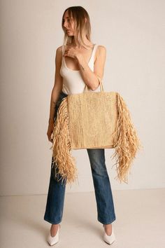 Same day shipping on Modern Weaving. Raffina tote with woven handles, and 12" draped fringe at sides. Tote measures 20"w x 18"h x 3" depth. Handcrafted in France. Beige Fringe Tote Shoulder Bag, Rectangular Beige Bag With Fringe, Beige Rectangular Bag With Fringe, Beige Fringe Bag For Shopping, Beige Fringe Shoulder Bag For Shopping, Beige Fringe Shopping Bag, Beige Rectangular Fringe Bag, Rectangular Fringe Bags For Shopping, Rectangular Fringed Shopping Bag