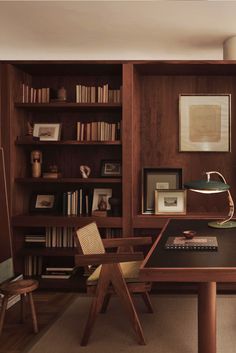 an image of a room with bookshelves and furniture