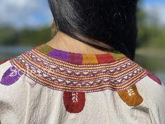 This beautiful Mexican Embroidered Blouse is perfect for any formal event or daily use! These blouses are hand embroidered by Mexican Artisans and completely one of a kind. Note: Model is wearing a M/L Bohemian Multicolor Embroidered V-neck Top, Multicolor V-neck Blouse With Embroidered Neckline, Multicolor Long Sleeve Tops With Traditional Patterns, Bohemian Multicolor Embroidered Festive Top, Bohemian Tops With Woven Motifs For Festive Occasions, Festive Bohemian Tops With Woven Motifs, Festive Multicolor Tops With Traditional Patterns, Festive Bohemian Blouse With Traditional Patterns, Traditional Multicolor Tunic Blouse