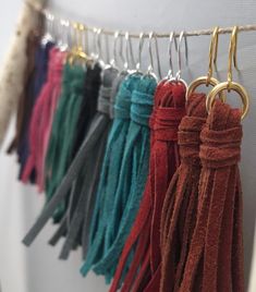 several tassels hanging on a rope with hooks