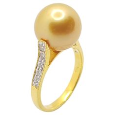 South Sea Pearl with Diamond 0.20 carat Ring set in 18 Karat Gold Settings Width: 1.0 cm Length: 0.9 cm Ring Size: 49 Total Weight: 4.05 grams South Sea Pearl: 10.4 mm "We first opened doors in 1980 when it was then situated in the vicinity of the Victory Monument; a small and modest storefront with a couple of counters. From its humble beginnings to where it stands today, our company has proven its abilities as a jeweler. Since the beginning, we have been supplying fine quality pieces to dealers, wholesalers and customers worldwide. From then till now, our business still interrelates its name with quality products and excellent service, where commitment and sincerity toward customers will always be its motto." Diamond Dress Ring, Golden South Sea Pearls, Pearl And Diamond Ring, Diamond Ring Settings, Sea Pearl, Bracelet Design, Jewelry Lookbook, South Sea Pearls, Sea Pearls