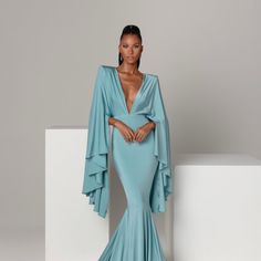 Harlow Long Evening Dress With Draped Sleeves For Gala, Gala Evening Dress With Draped Sleeves, Elegant Blue Maxi Dress With Cape Sleeves, Floor-length Evening Gown With Draped Sleeves, Floor-length Gown With Draped Sleeves For Evening, Chic Floor-length Gown With Draped Sleeves, Evening Maxi Dress With Sweep Train And Cape Sleeves, Elegant Blue Gown With Cape Sleeves, Chic Gala Gown With Cape Sleeves