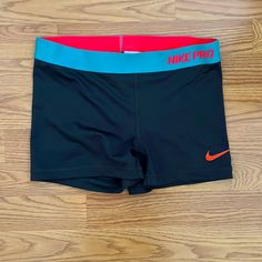 Nike Pro Dri-Fit Bike Shorts. Gray With Teal And Bright Orange Hem. In New Condition. Never Worn Because I Ordered Wrong Size. Nike Sporty Shorts For Swimming, Nike Moisture-wicking Shorts For Swimming, Orange Athletic Sportswear Shorts, Sporty Orange Swim Shorts, Orange Activewear Shorts For Sports, Sporty Orange Short Length Activewear, Sporty Orange Short-length Activewear, Orange Short Length Activewear For Sports, Orange Sportswear Shorts For Sports