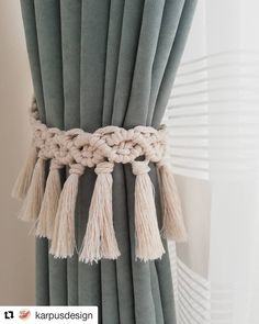 a curtain with tassels hanging from it