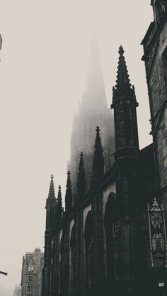 an old gothic church in the foggy city