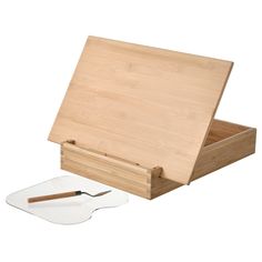 a cutting board and knife in a wooden box