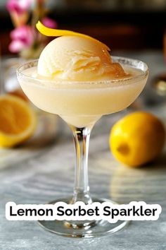 the lemon sorbet sparkler is served in a coupe glass with ice cream