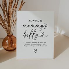 a card with the words how big is mommy's belly written in cursive font