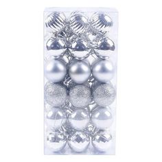 silver and white christmas ornaments in a package