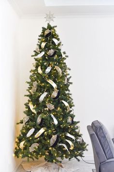 a christmas tree decorated with ribbons and lights