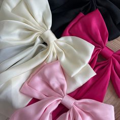 As the newest addition to our bow collection, the luxe silk bow does not disappoint. This oversized bow elevates and adds a pop to any holiday outfit. - Material: Satin - Size: 8.9(L) x 12.6(H) inches - Tight, clasping barrette closure - Designed with love in San Diego Shop the rest of our bow collection here FAQ click here Return Policy click here Chic Detachable Bow For Summer, Chic Summer Bow, Chic Decorative Bow For Black Tie Events, Summer Party Bow Tie With Detachable Bow, Satin Decorative Bow For Black Tie Events, Chic White Bow For Party, Satin Bow For Black-tie Events, Detachable Bow Satin Bow Tie For Party, Satin Bow Tie With Ribbon For Party