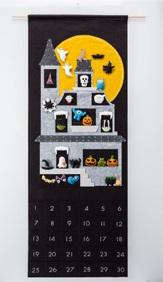 an image of a house made out of felt with halloween decorations on the front and side