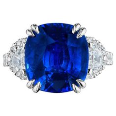 • Platinum • Size 6.5 • 9.93 Carats • Number of Cushion Cut Sapphires: 1 • Carat Weight: 8.86ctw • Color: Vivid Blue – Royal Blue • Certificate: GRS2020-012095 • Number of Half moon Diamonds: 2 • Carat Weight: 0.61ctw • Number of Round Diamonds: 24 • Carat Weight: 0.46ctw • A beautiful royal blue cushion cut natural sapphire is flanked by 2 perfectly matched half moon diamonds. The sapphire is certified as a natural sapphire, originating from Sri Lanka, and is vivid royal blue in its color. The Royal Blue Sapphire Ring, Golden Ring, Modern Ring, Fancy Jewelry, Blue Sapphire Rings, Natural Sapphire, Cushion Cut, Three Stone Rings, I Love Jewelry