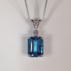 "Gorgeous London Blue Topaz & White Sapphire Necklace * Emerald Cut London Blue Topaz measures 8mm x 6mm * Brilliant Cut White Sapphire Accent * 1.85cts total Gemstone weight * Solid Sterling Silver * 18\" Sterling Silver Chain Included Hallmarked & Gift Ready! Matching Earrings & Ring Available TIMELESS, BEAUTIFUL & UNIQUE FINE ART JEWELRY" White Sapphire Necklace, Necklace Emerald, Beautiful London, Trending Jewelry, Best Friend Jewelry, Blue Topaz Necklace, Fine Art Jewelry, Sapphire Necklace, Sterling Silver Necklace Pendants