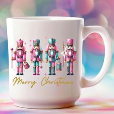 a white coffee mug with three nutcrackers on it's side and merry christmas written across the front