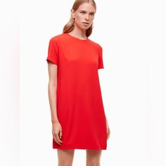 Like Brand New! This Vibrant Classy Aritzia Short Sleeve Shift Dress Is Perfect For Work Or Any Occasion: Extremely Flattering. You Are Sure To Stand Out In This Bright Red. Sbrand: Aritzia / Babaton Size: 2 Color: Bright Red Item: Babaton Patricio Mini Shift Dress In Bright Vibrant Red This Is A T-Shirt Mini Dress With An A-Line Silhouette. Invisible Zipper At Neckline In Back. Condition: Used - Excellent Condition! Red Shift Dress With Short Sleeves, Red Knee-length Shift Dress, Red Shift Knee-length Dress, Red Shift Dress, Knee-length, Aritzia Dress, Aritzia Babaton, Mini Shirt Dress, Mini Shift Dress, Dress Red