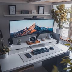 a desktop computer sitting on top of a white desk