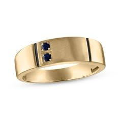 a yellow gold ring with blue sapphire stones