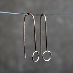 Minimalist silver wire earrings, dainty and delicate.  These geometric threaders are super lightweight and very comfortable to wear. You'll forget that you have them on. They look awesome for any occasion, discrete and simple but unique and elegant.  The total drop length measures about 1 3/16 inches (30mm). The idea behind this design was to create a pair of earrings with an elegant and simple look easy to match with any outfit. Choose between solid silver, 14k rose gold filled brass or 14k yellow gold filled brass in the drop down box. The wire is hardened, which make the earrings more resistant against deforming. You will receive these earrings in box ready to give as gift. For more unique jewelry: www.etsy.com/shop/BGLASSbcn Follow me on Instagram: @bgalssbcn Thank you for visiting my Affordable Minimalist Sterling Silver Earrings, Affordable Minimalist Wrap Earrings, Minimalist Hypoallergenic Wrap Earrings, Affordable Hypoallergenic Minimalist Wrap Earrings, Simple Wire Earrings Antique, Drop Earrings Simple Short Silver, Cheap Silver Minimalist Linear Earrings, Cheap Minimalist Dangle Jewelry, Cheap Minimalist Silver Jewelry