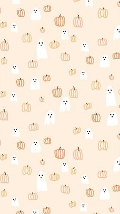 an orange and white halloween pattern with cats, pumpkins and ghost faces on it