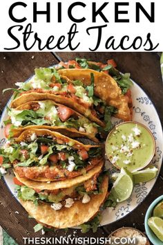 chicken street tacos on a plate with guacamole and salsa