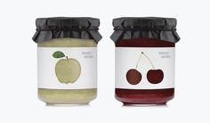 two jars of apple jam with labels on them