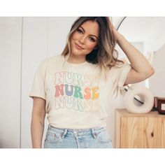 a woman wearing a t - shirt that says labor and delivery nurse