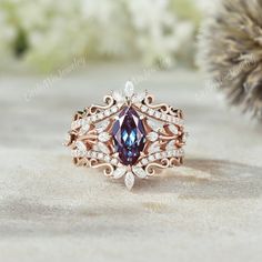 a ring with a blue stone surrounded by diamonds