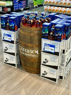 several wooden barrels stacked on top of each other in a grocery store filled with drinks