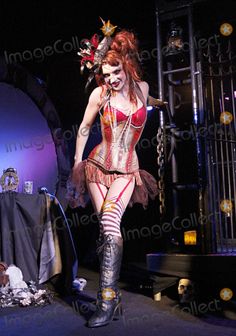 a woman in a costume on stage