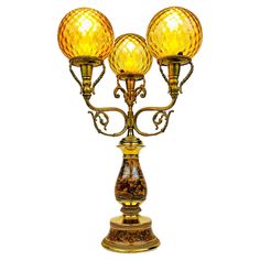 an antique style lamp with three lights on it