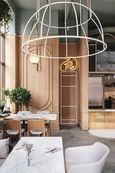 the interior of a restaurant with tables and chairs