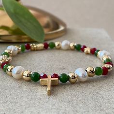 Mini Cross Bracelets This design bracelets are made of green agate, pearls. When people think of the colors red and green, one thing comes to mind: Christmas.  Red has long been a powerful color associated with fire, spiritual awakening, and the blood of Jesus Christ, whose birthday is celebrated on December 25.  Green often symbolizes money, good luck, and health through the holidays and into the new year. ☆ Each of the pearls we use to create bracelets were formed by nature over years. Each on Christmas Friend Ship Bracelets, Cheap Elegant Christmas Bracelets, Cheap Holiday Beaded Bracelets For Gift, Christmas Themed Bracelets, Christmas Bead Jewelry, New Year Bracelet, Elegant Beaded Bracelets As Christmas Gifts, Elegant Beaded Bracelets For Christmas Gift, Green Beaded Bracelets For Christmas