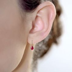 Enhance any wardrobe with these beautiful Ruby earrings. These earrings showcases genuine natural pear-shape 7x5 mm Rubies and white diamonds set in a dangle drop design. Crafted of 10k Rose Gold these earrings make a wonderful addition to your jewelry collection. Elegant drop dangle earrings featuring July birthstone Ruby 7x5mm Pear-shape Rubies Round White Diamonds (other gemstone colors available) Genuine Natural Rubies, Conflict-free Genuine Diamonds, Solid 10k Rose Gold, Post-pushback earri Luxury Ruby Gemstone Diamond Earrings, Luxury Ruby Earrings With Gemstone Accents, Fine Jewelry Teardrop Earrings For Gift, Fine Jewelry Teardrop Pendant Earrings As Gift, Ruby And Diamond Earrings, December Birthstone Jewelry, Ruby Birthstone, Tanzanite Earrings, September Birthstone Jewelry