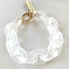 "Survive this past year like a badass? Searching for a gift for that badass in your life? This might just be the perfect gift! White frosted acrylic links are combined with a toggle clasp and CZ pave \"BADASS\" charm (gold or silver). For an average size wrist, we recommend a length of 8 3/4 inches on this design (so it has some room to move around easily), but it can custom ordered to any desired length (just make a note in the personalization section if you would like a different length). This Leopard Face, Frosted Acrylic, Alexandria Va, Eyeglass Chain, Bracelet Clasps, Love Mom, How To Make Notes, Toggle Clasp, Handmade Design